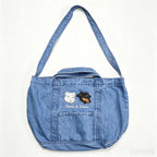 Denim Crossbody Bag: Upload your pet's photo for a custom embroidered bag! A soft, washed denim crossbody perfect for casual shopping.